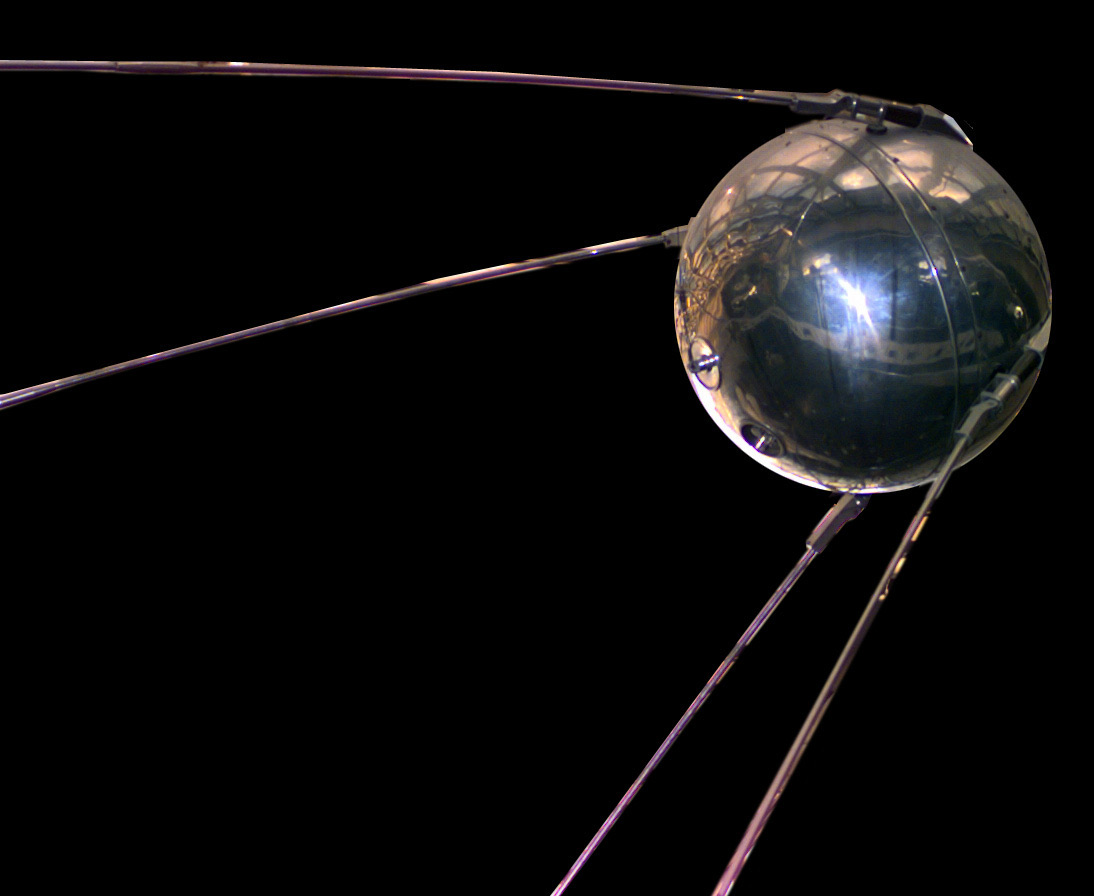 Replica of Sputnik 1 satellite against a black background, representing AI's Sputnik moment